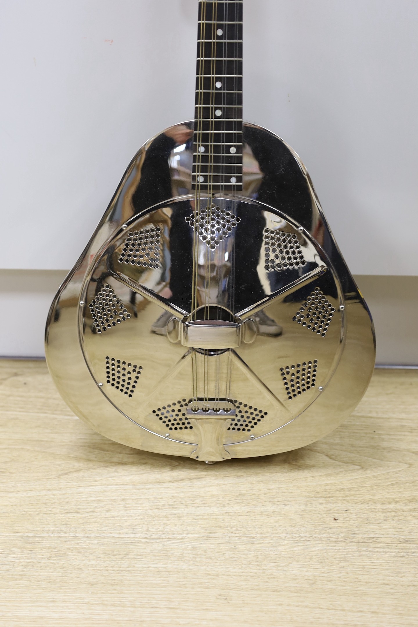 An Ashbury mandolin ‘Resonator’ with fitted, padded case, mandolin 69 cms high.